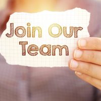 business woman holding tear paper with join our team text